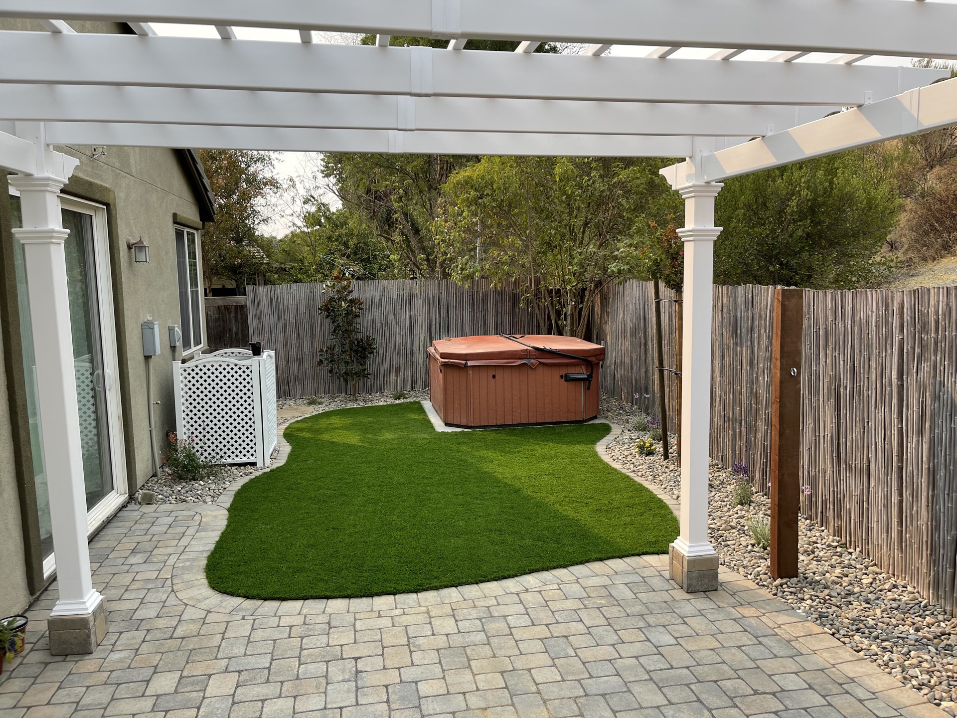 Pergola patio with artificial turf and pavers — New Era Landscape project